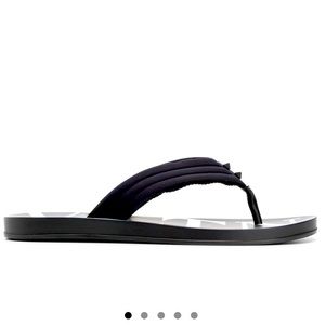 Feature the brand signature logo in white and signature pyramide studs in front